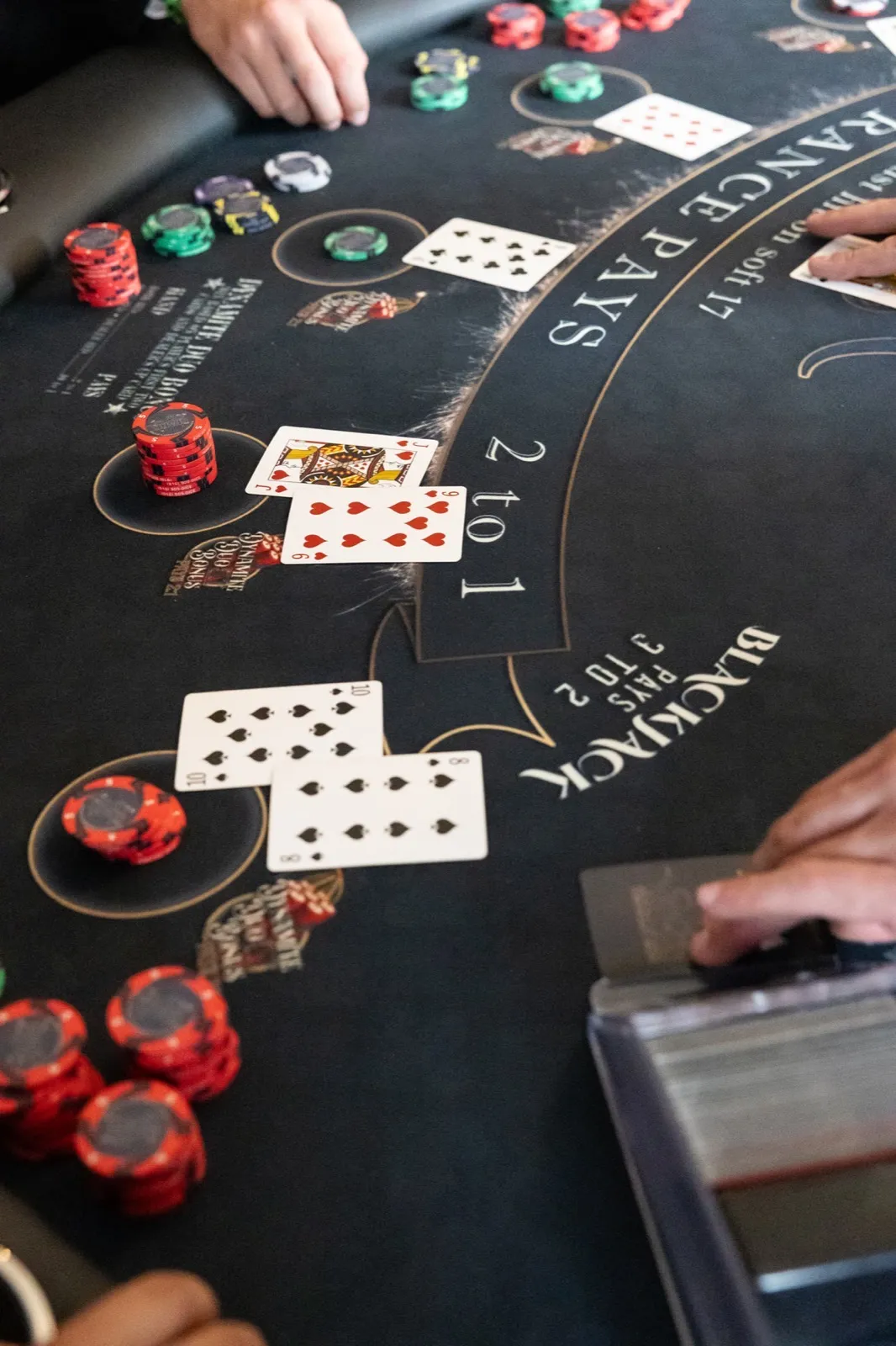 Close-up of cards dealt at a Spark casino table during a Sacramento retirement party