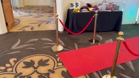 Spark red-carpet photo booth setup with props and backdrop