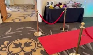 Spark red-carpet photo booth setup with props and backdrop