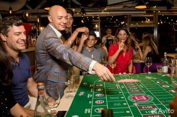 Guests playing craps at a Spark casino night table in Sacramento