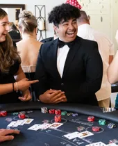 Guests celebrating at a Spark blackjack table