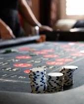 Casino chips stacked on a Spark roulette table