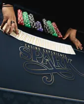 Card fan on the custom Spark casino felt