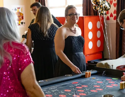 Guests around a Spark roulette table
