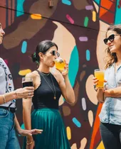 Guests enjoying cocktails at a Spark party