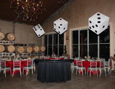 Winery casino night with hanging dice over the tables