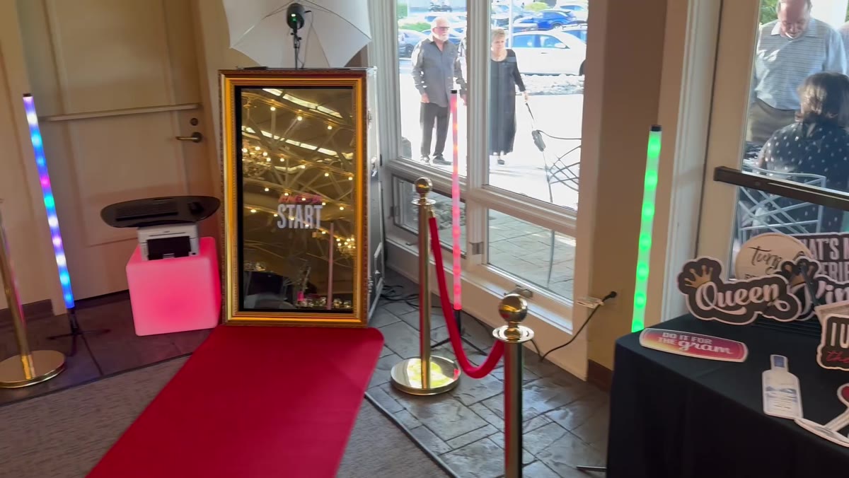 Spark Magic Mirror photo booth with red carpet and velvet ropes