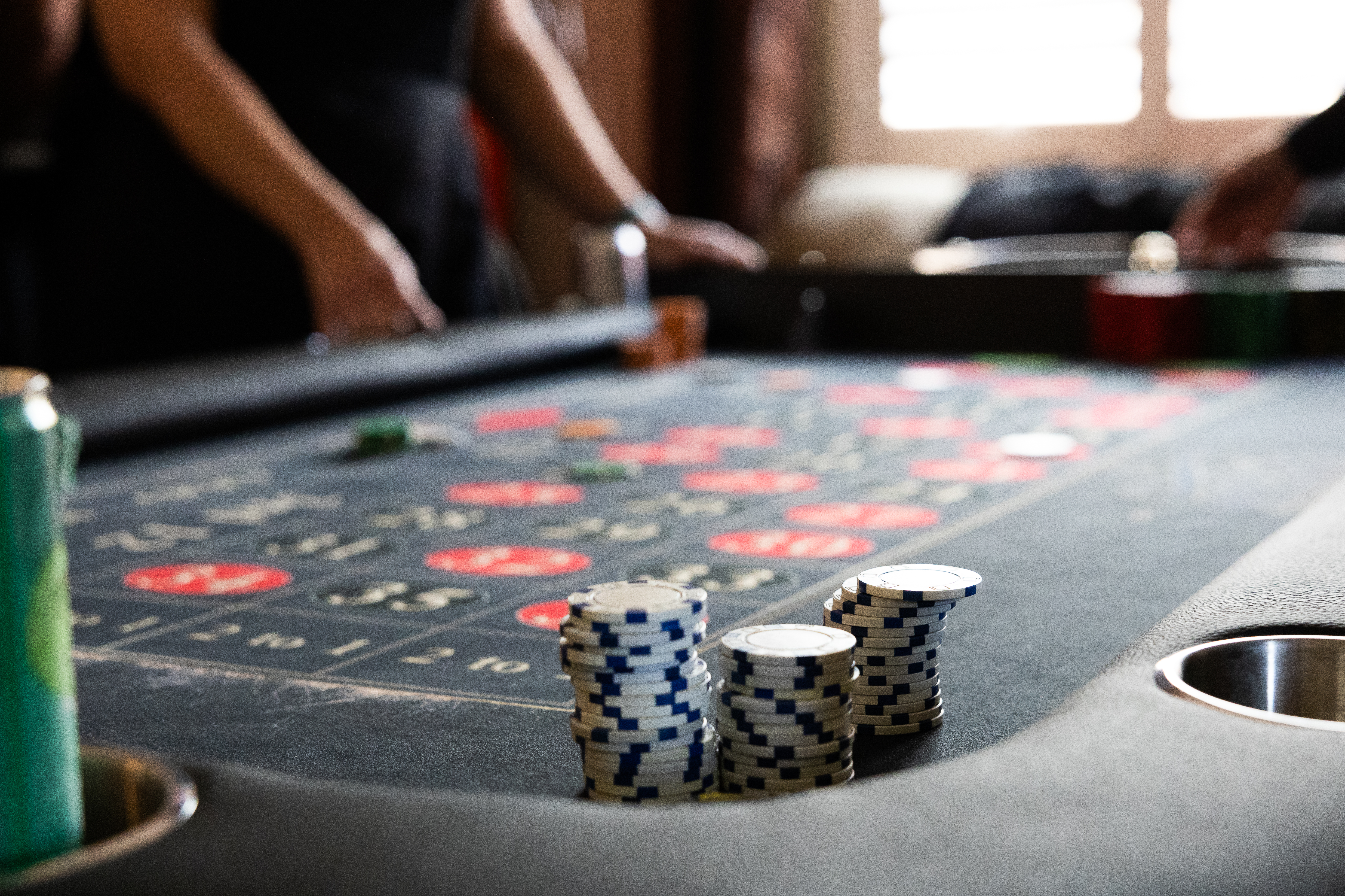 Casino chips stacked on a Spark roulette table