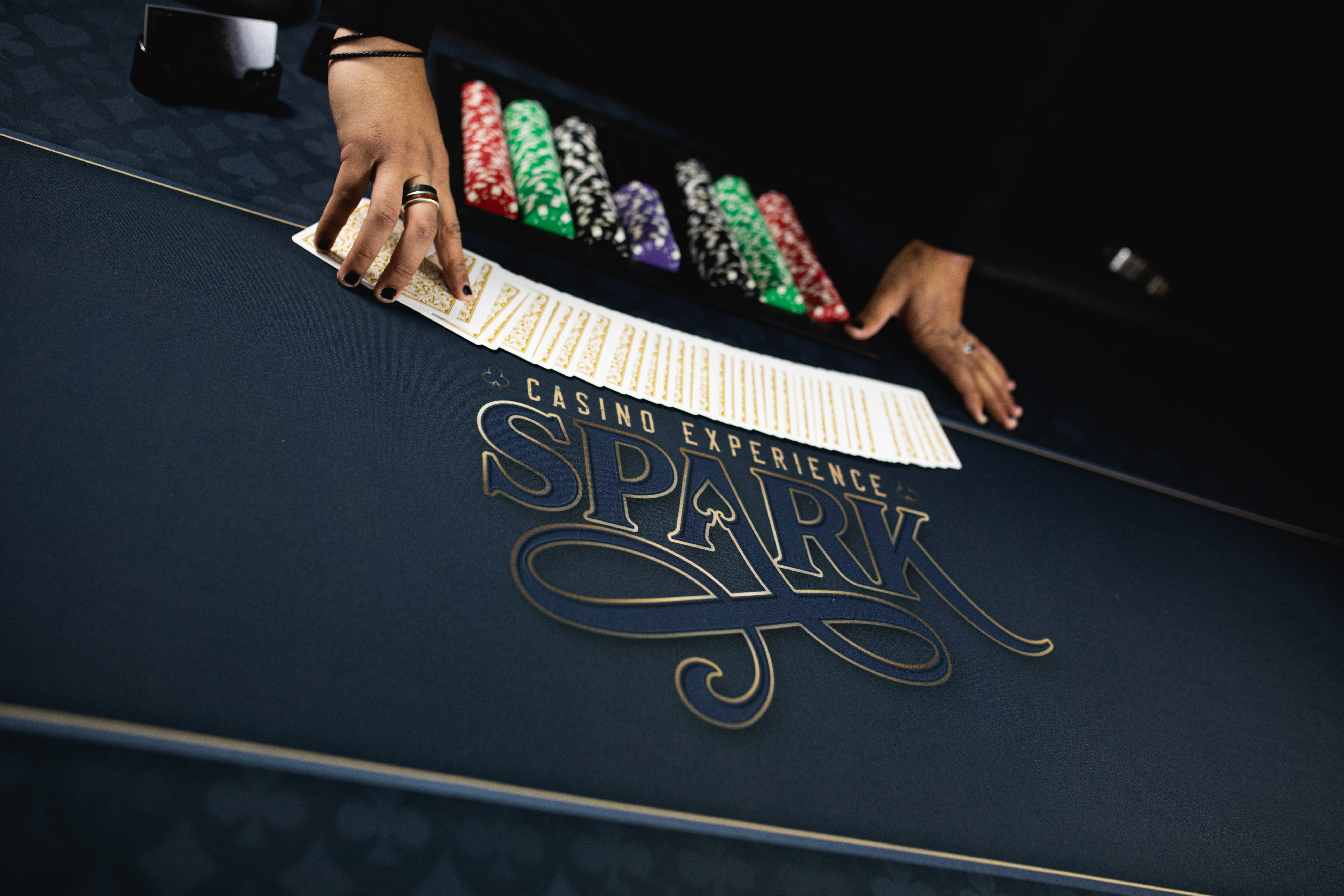 Card fan on the custom Spark casino felt